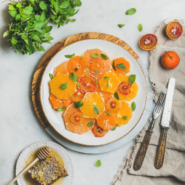 istock Fresh citrus fruit salad with mint and honey, square crop 821186504
