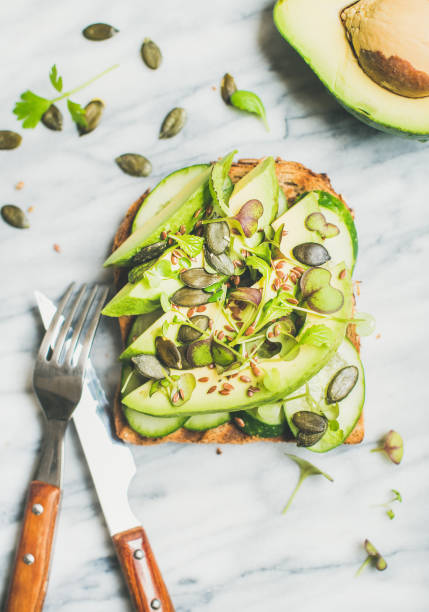 istock Healthy green veggie breakfast concept with sandwich, top view 821186912