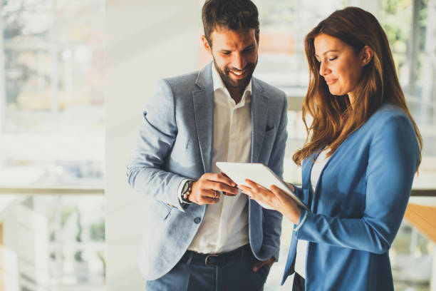 istock Young business couple working on tablet 821190552