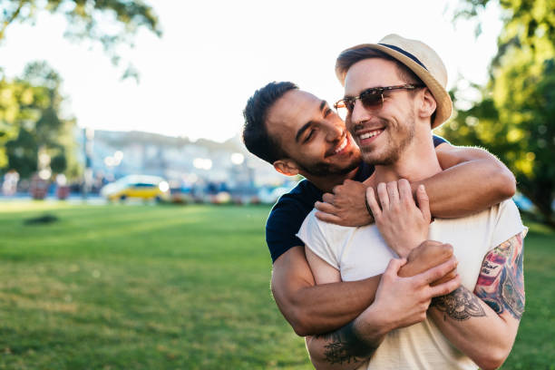 istock Multi ethnic gay couple hugging 821194010