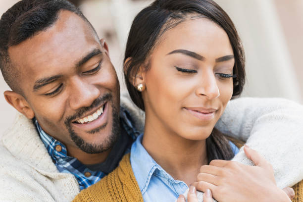 istock Affectionate young mixed race couple on front porch 821199374