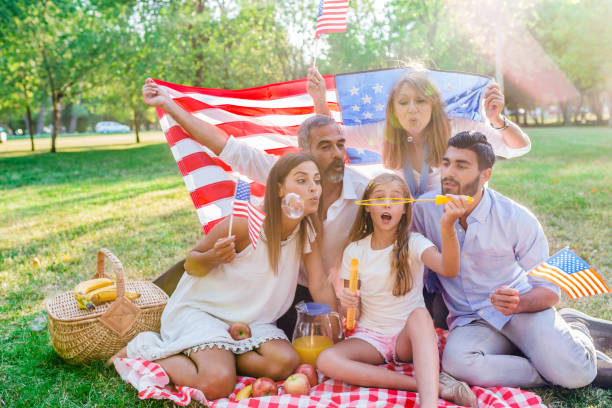 istock Multi Generation family blowing bubbles in the park 821199540
