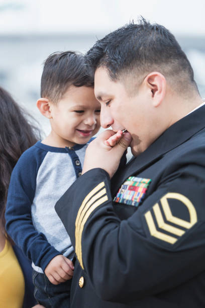 istock Hispanic military man with little boy 821199556