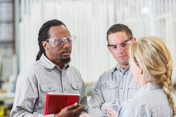 istock Multi-ethnic workers in factory having meeting 821200024