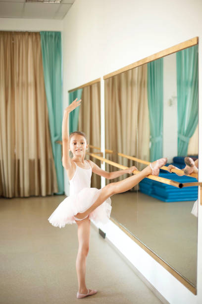 istock Little ballerina in ballet studio 821205308