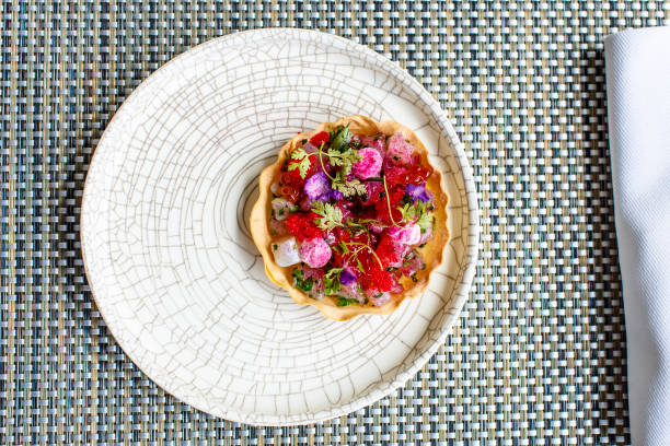 istock Appetizer of fish, caviar and flowers is in slice 821205382