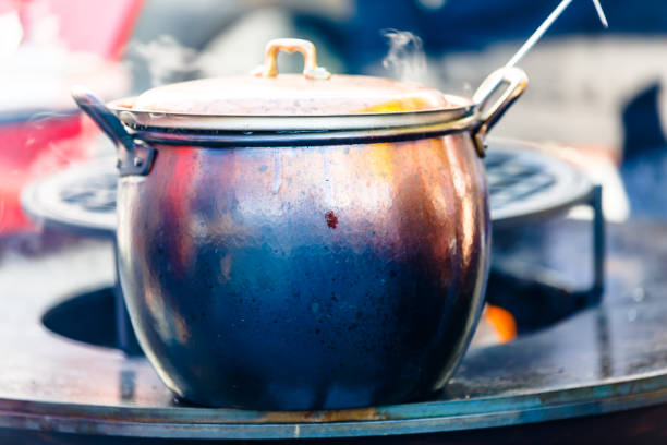 istock A large pot stands on the hearth fire in the street. 821205636