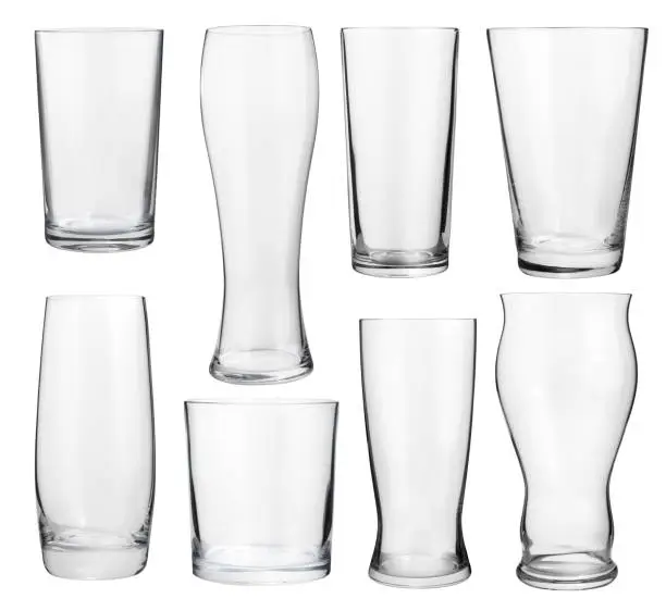 Collection of empty glasses for alcohol and soft drinks