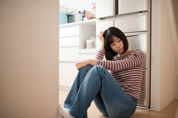 istock depression image of young woman 821212532