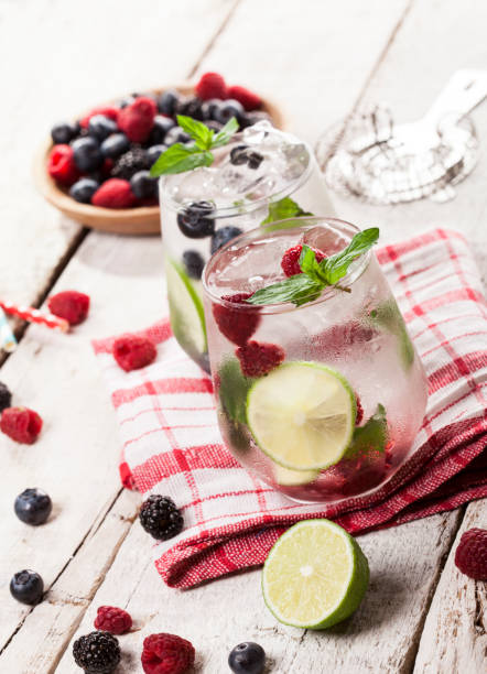 istock Summer cold drinks with raspberries, blackberries and blueberries on white background 821212598