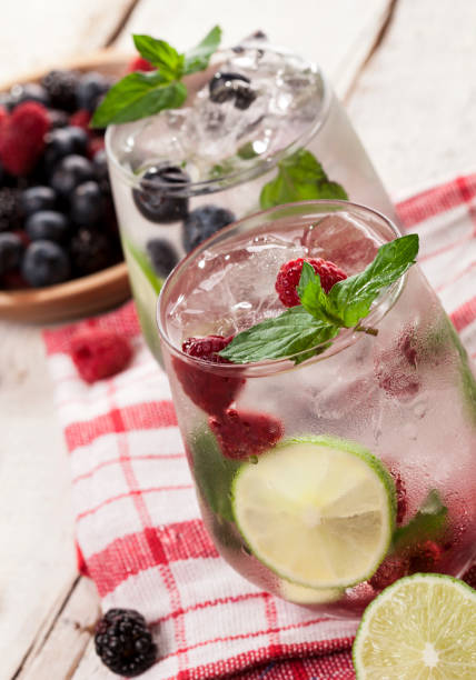 istock Summer cold drinks with raspberries, blackberries and blueberries on white background 821212624