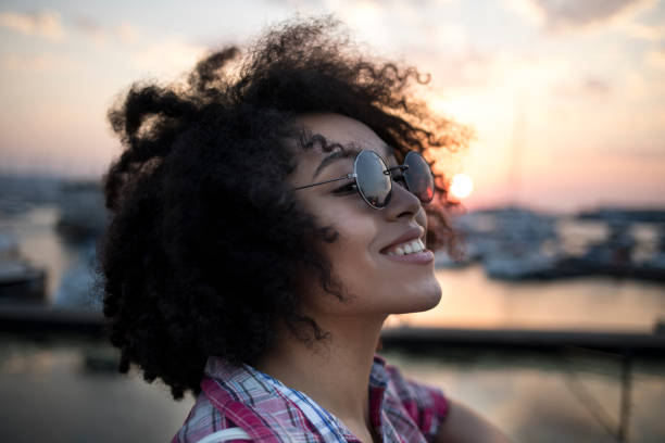 Young woman having fun at sunset