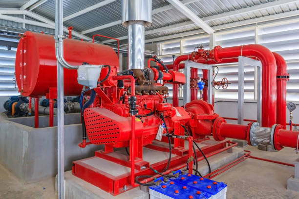 istock Industrial fire pump station for water sprinkler piping and fire alarm control system. Pipelines, water pump, valves, manometers. 821232092