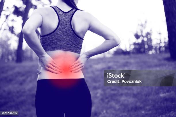 Back Injury In Training Stock Photo - Download Image Now - Backache, Exercising, Jogging