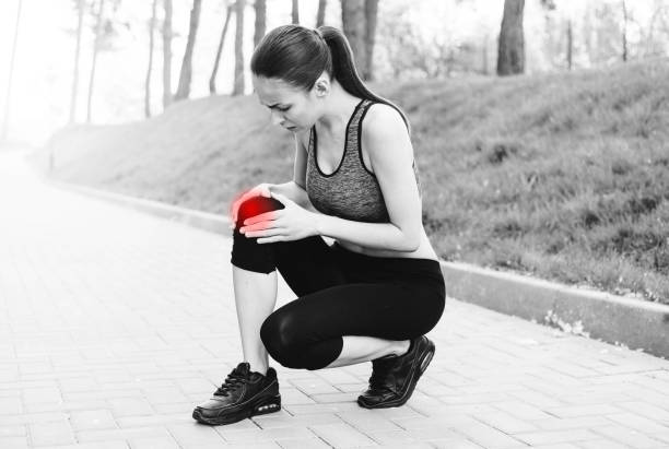 istock Knee in sportswoman injured on a run 821235202