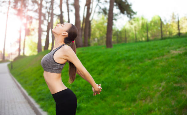 istock Young fit woman stretching after running 821235262