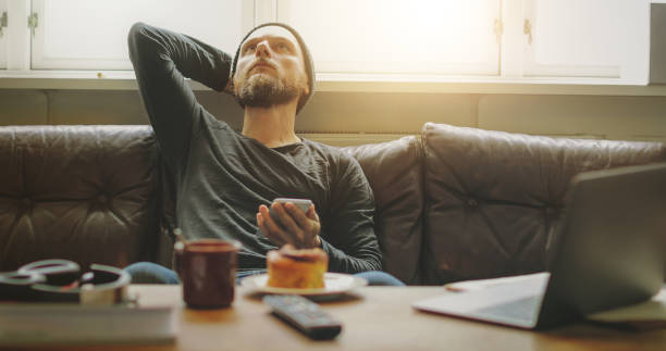 istock Man relaxed at home, takes a break 821238842