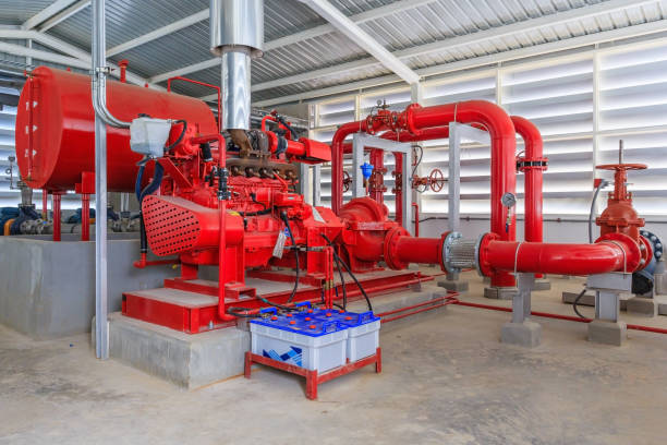istock Industrial fire pump station for water sprinkler piping and fire alarm control system. Pipelines, water pump, valves, manometers. 821244336