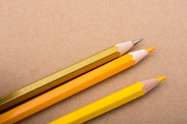 istock Color Pencils on a brown background 821251946