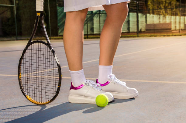 istock Tennis concept female , focus on snickers and racket 821254898