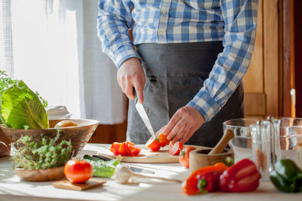 istock male cooking healthy salad 821258802