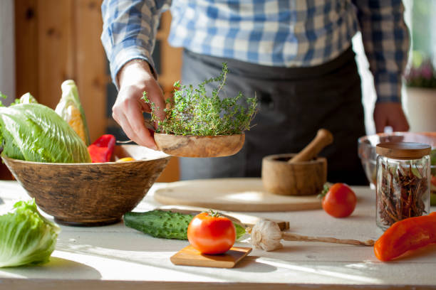 istock male cooking healthy salad 821261456