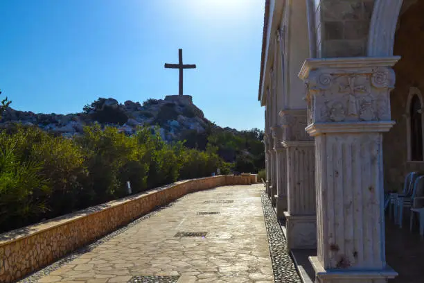 Wooden cross on a rock near the church of St. Epiphany. Cyprus. Ayia Napa
