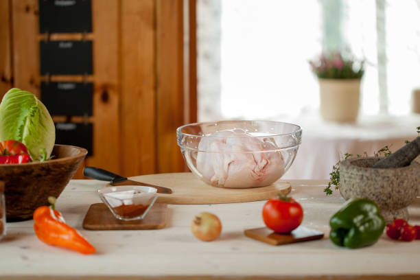 male preparing chicken for cooking