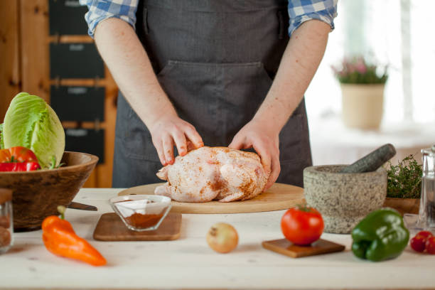 istock male preparing chicken for cooking 821264426