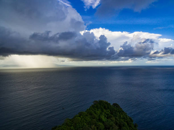 Sunny and rainy Sunny day in the clouds in the rain ternate stock pictures, royalty-free photos & images