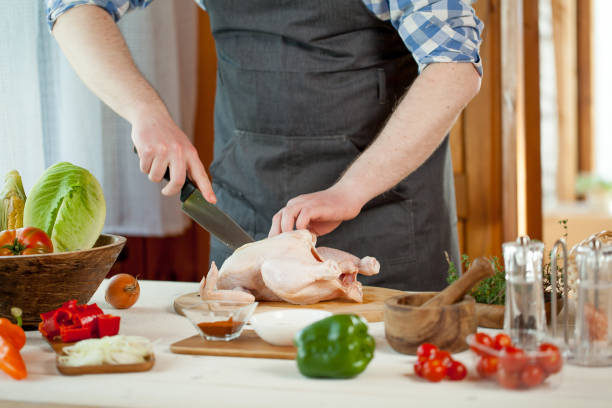 istock male preparing chicken for cooking 821267814
