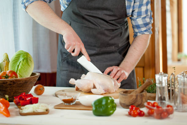 istock male preparing chicken for cooking 821267974