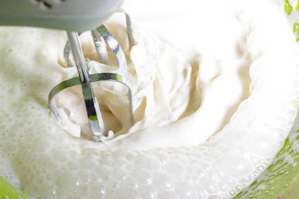 Whipping cream from cow's milk with a mixer
