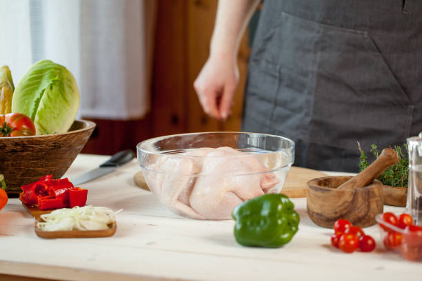istock male preparing chicken for cooking 821268296