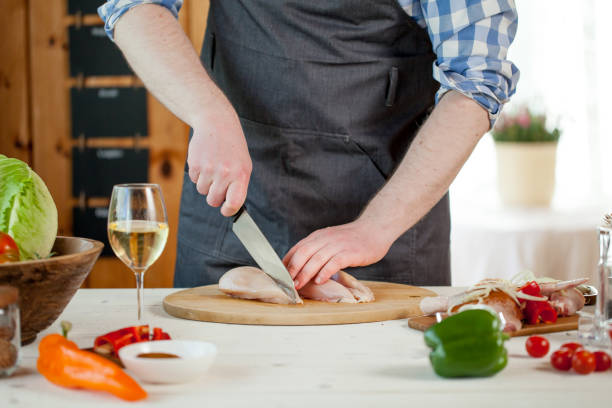 istock male preparing chicken for cooking 821268674