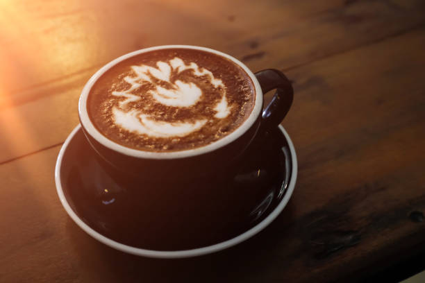 istock Coffee cup in coffee shop on wooden table. 821274838