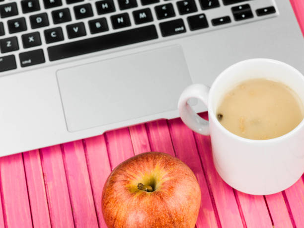 istock Cup of Mushroom Soup with a Red Apple and a Laptop Computer 821275822