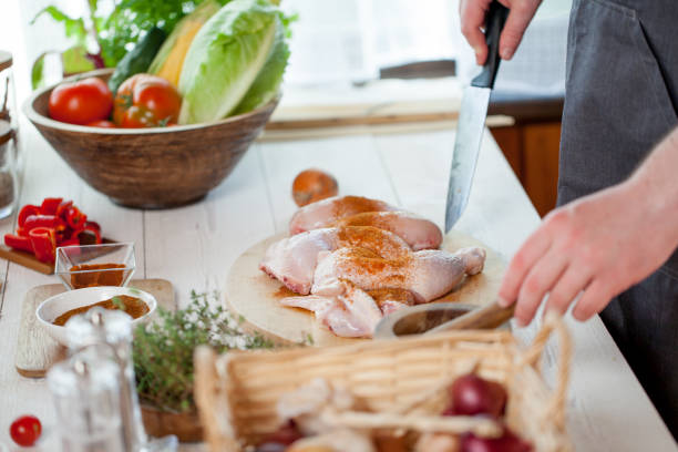 istock male preparing chicken for cooking 821281420