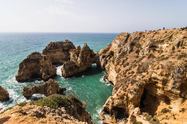 istock Beautiful atlantic ocean view horizon with sandy beach rocks and waves  with turist on beach 821282716