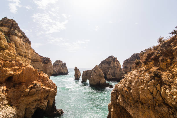 istock Beautiful sandstone rock formation with a cave on Atlantic beach 821282850