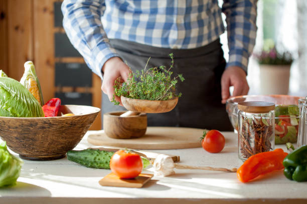 istock male cooking healthy salad 821283026