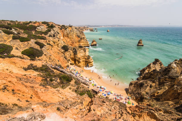 istock Beautiful atlantic ocean view horizon with sandy beach rocks  with stairs on beach on Atlantic ocean in Portugal 821285282