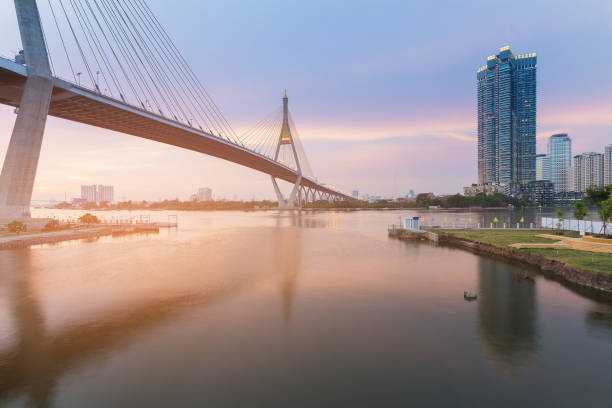 istock Rama9 Suspension bridge crossed Bangkok river with reflection view 821289474