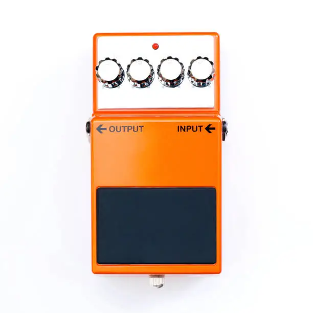 Top view of a guitar effect pedal on white background