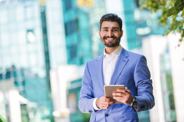 istock Young modern handsome businessman outdoors 821299024