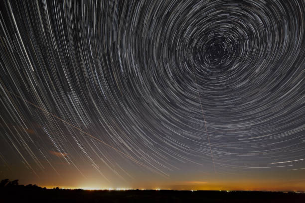 istock Night sky with bright stars trails. Astrophotography of outer space. 821305248