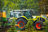 Agricultural tractor. Grain harvesting equipment in the field. The agricultural sector.