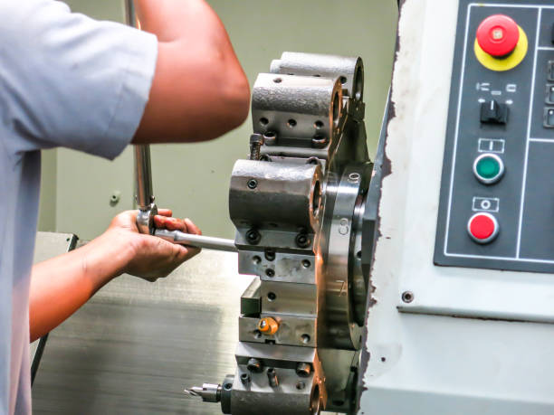 istock I use a wrench to tighten the nut. For machine maintenance 821312554