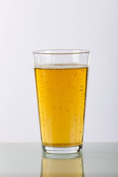 istock Plain Pint Glass of Beer with Reflection 821315270