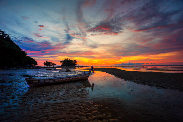istock Boat near the beach at sunset 821319800
